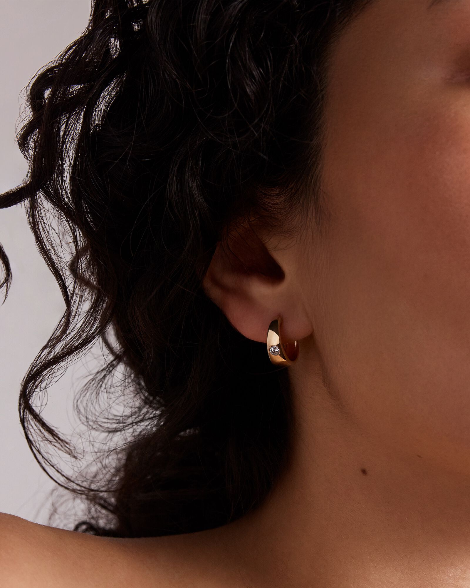 0.24 Carat TW of Laboratory-Grown Round Brilliant Diamond Huggie Earrings in 10kt Yellow Gold