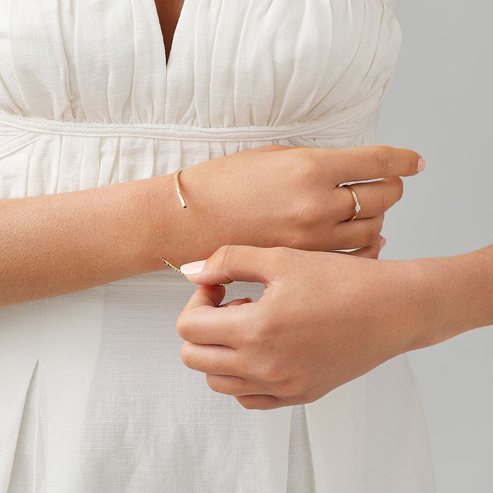 0.68 Carat TW Diamond Row Flex Bangle in 10kt Yellow Gold