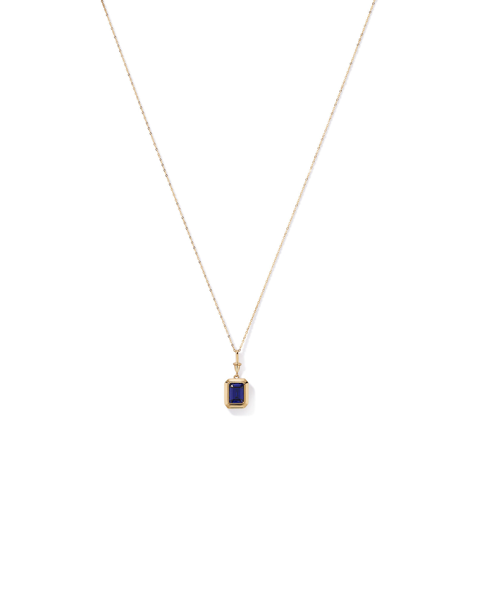 Emerald Cut Created Sapphire Bezel Pendant with Chain in 10kt Yellow Gold