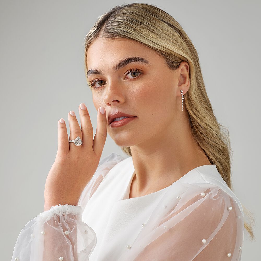 0.65 Carat TW Pear Shaped Cluster Halo Diamond Ring in 10kt White Gold